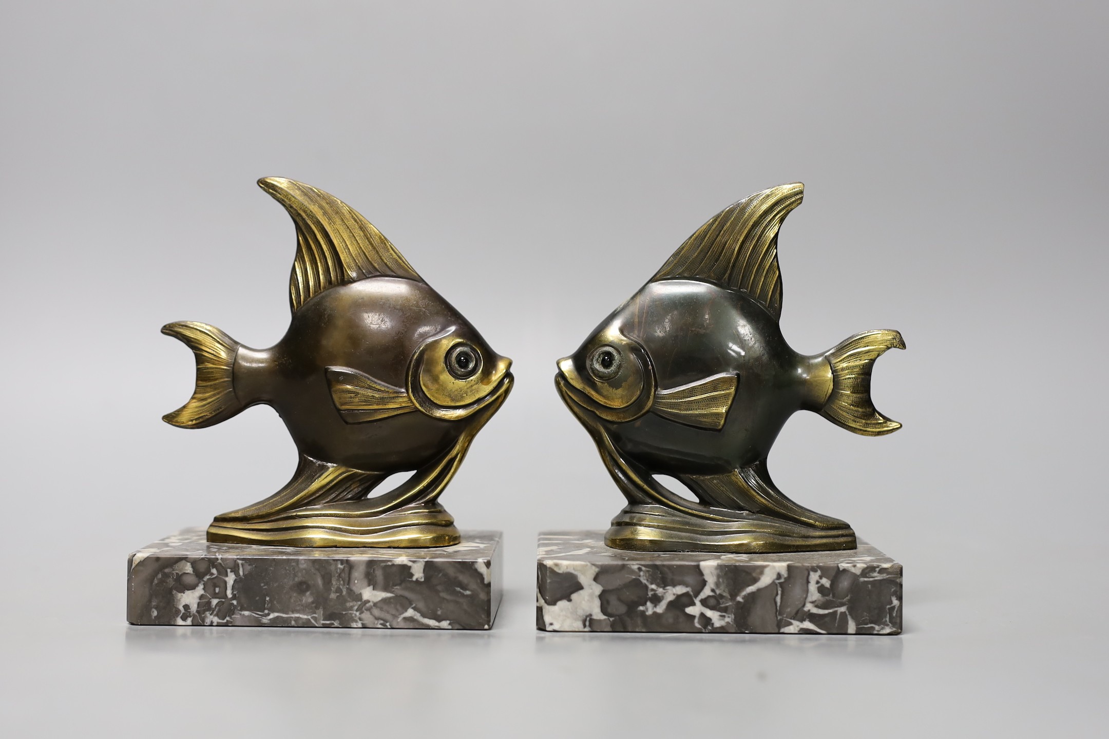 Two pairs of Art Deco spelter 'Angel fish' bookends. Tallest pair 20cm